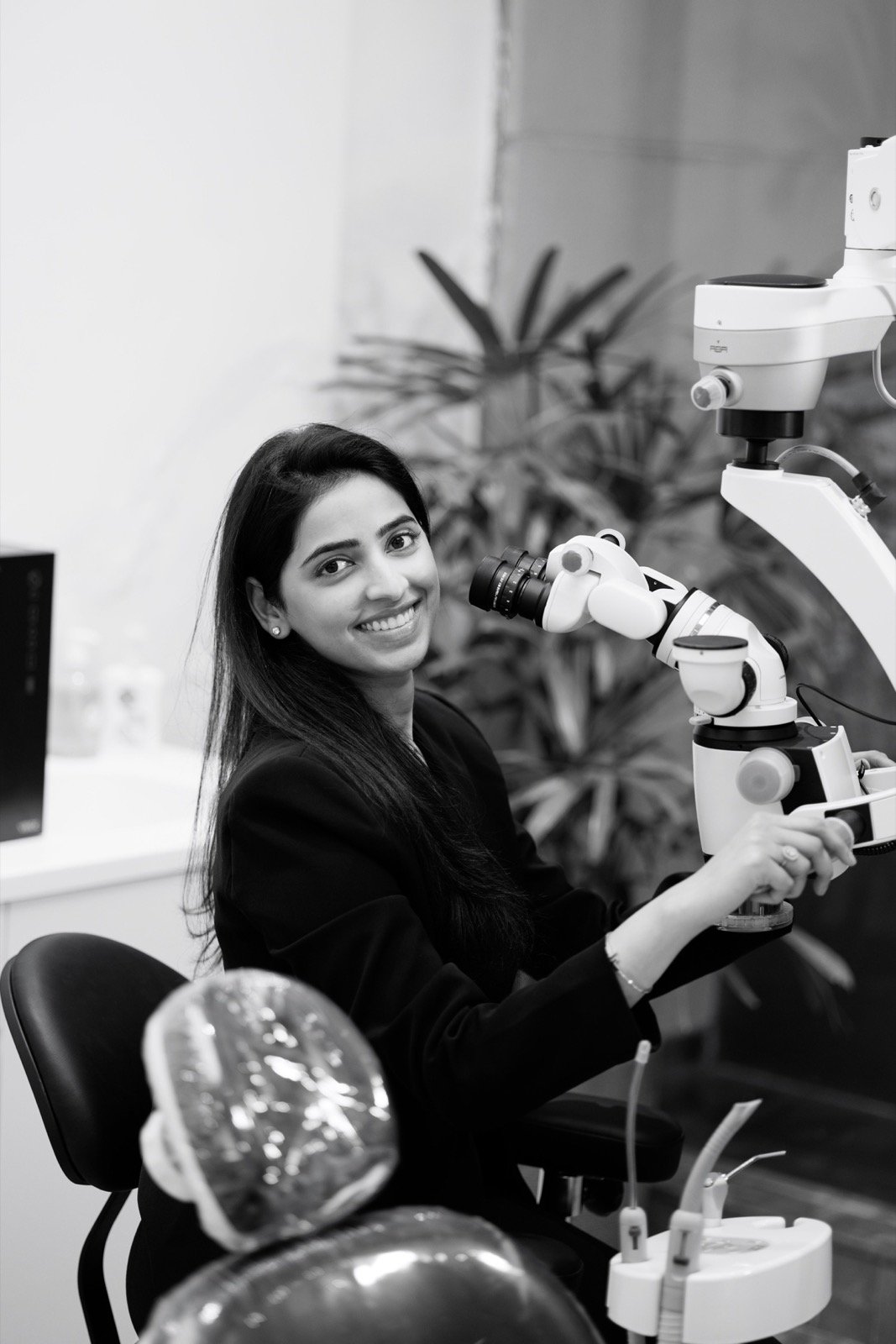 Dr. Esha Goel with her dental operating microscope