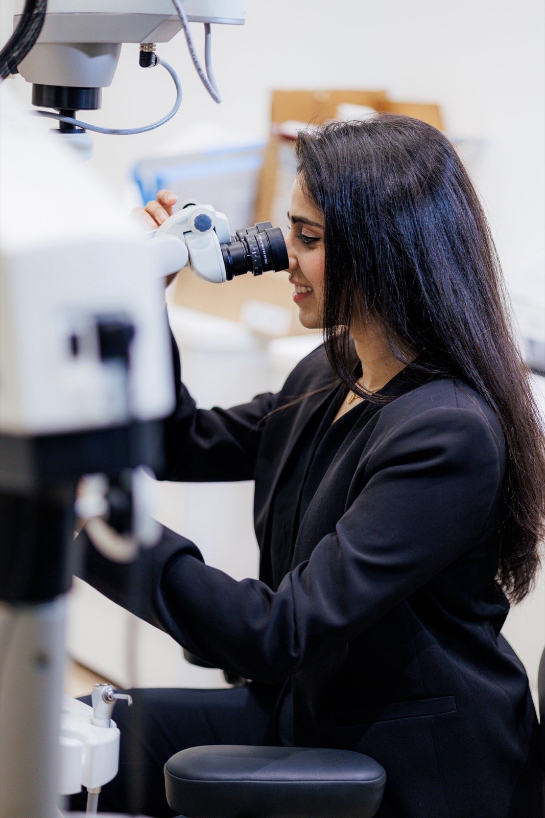 Dr. Goel working with the dental operating microscope