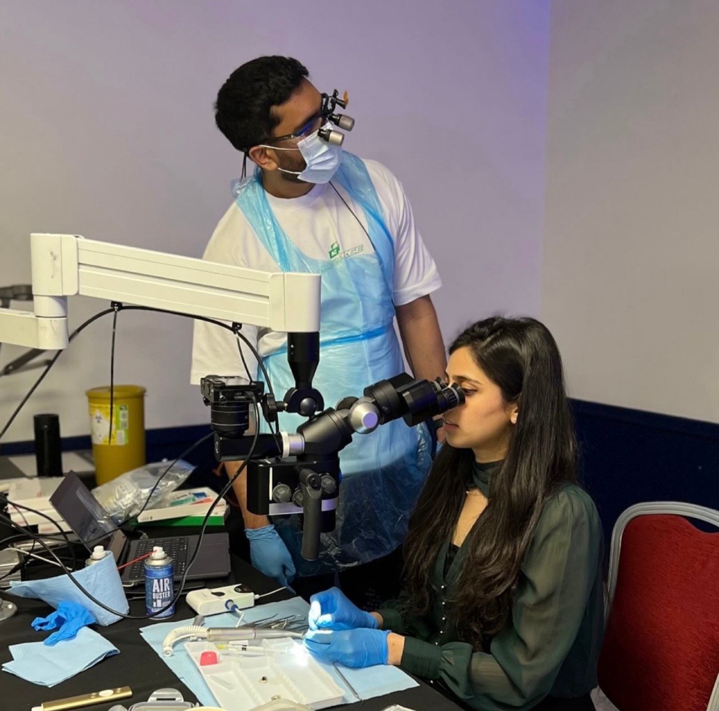 Dr. Goel teaching at the dental operating microscope