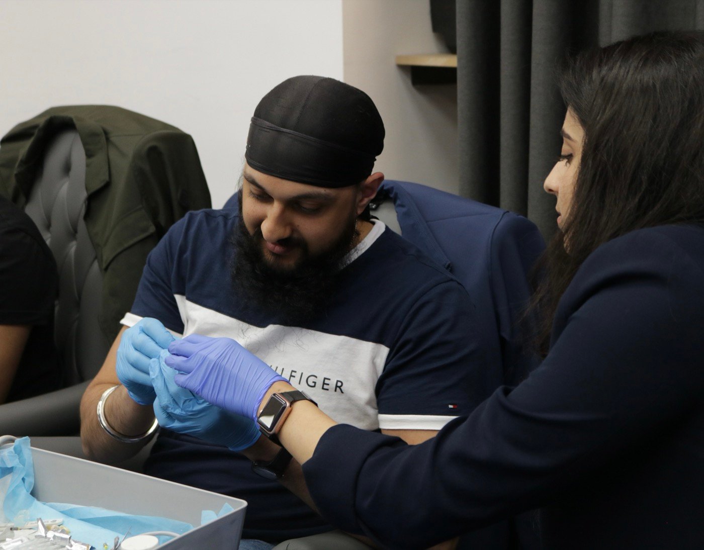 Dr. Goel guiding a delegate through hands-on practice
