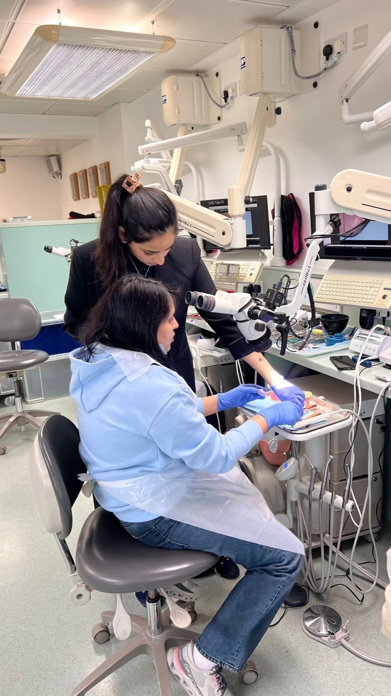 Dr. Goel supervising at the King's College London clinic